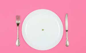 a plate with a pea in the middle