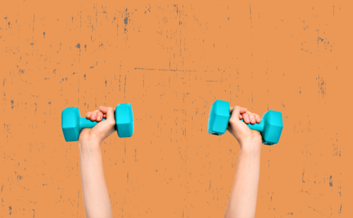 woman holding dumbbells