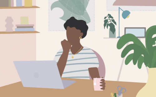 Woman looking at laptop on a desk