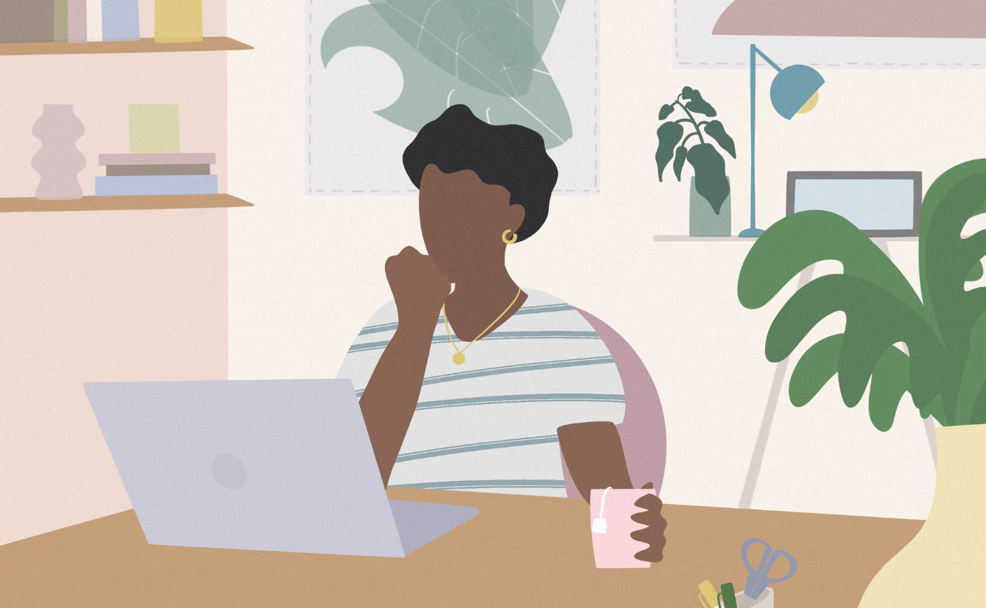 Woman looking at laptop on a desk
