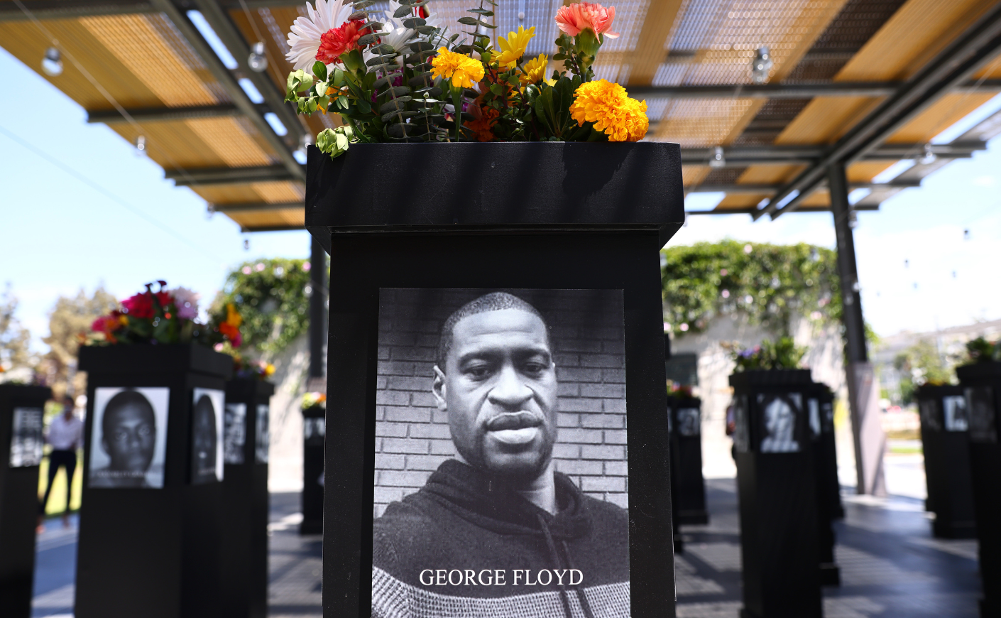 A memorial to George Floyd, topped with flowers