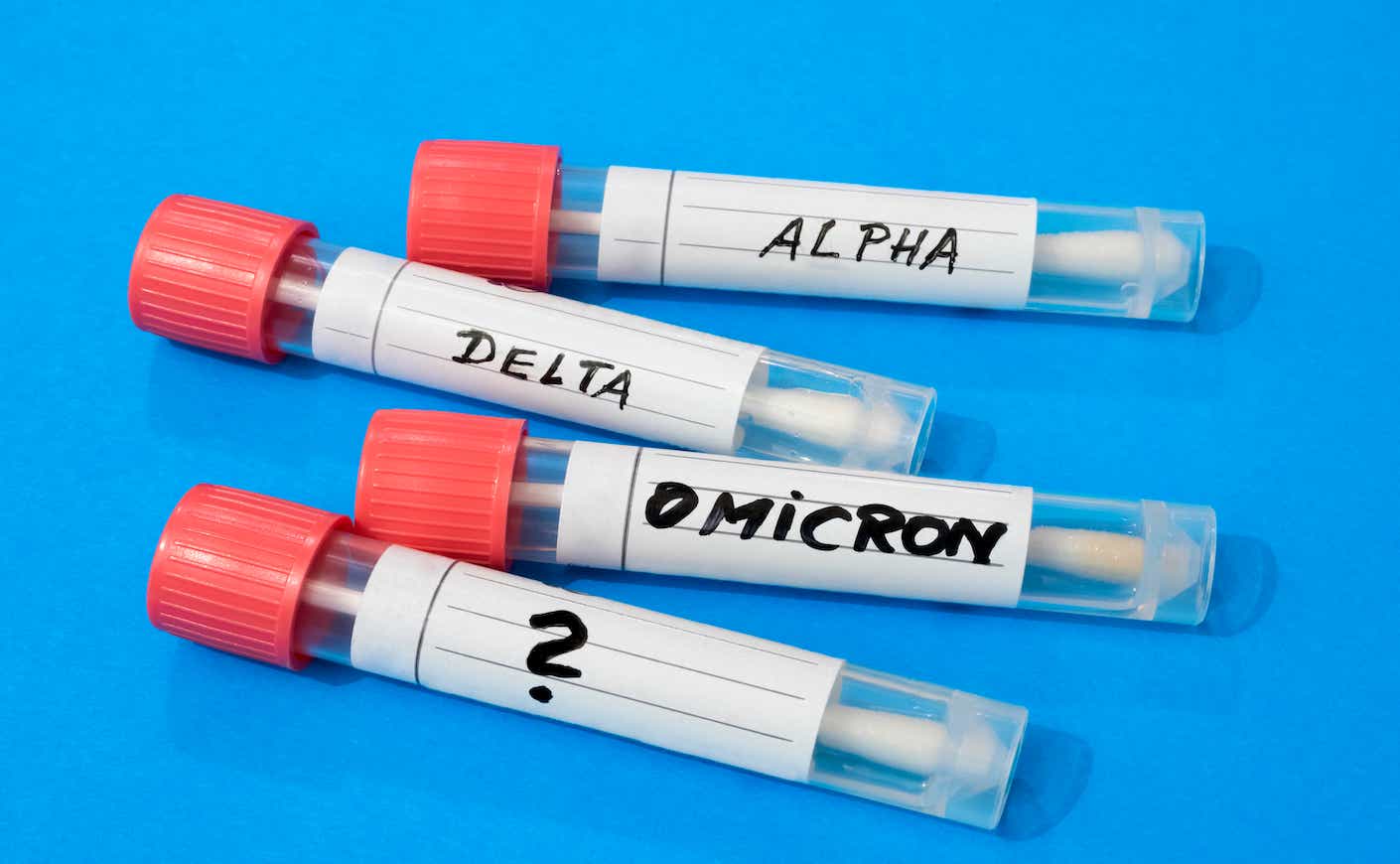 Swab tubes with medical samples on blue background