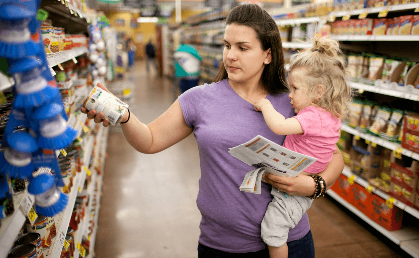 woman at the grocery store with food stamps