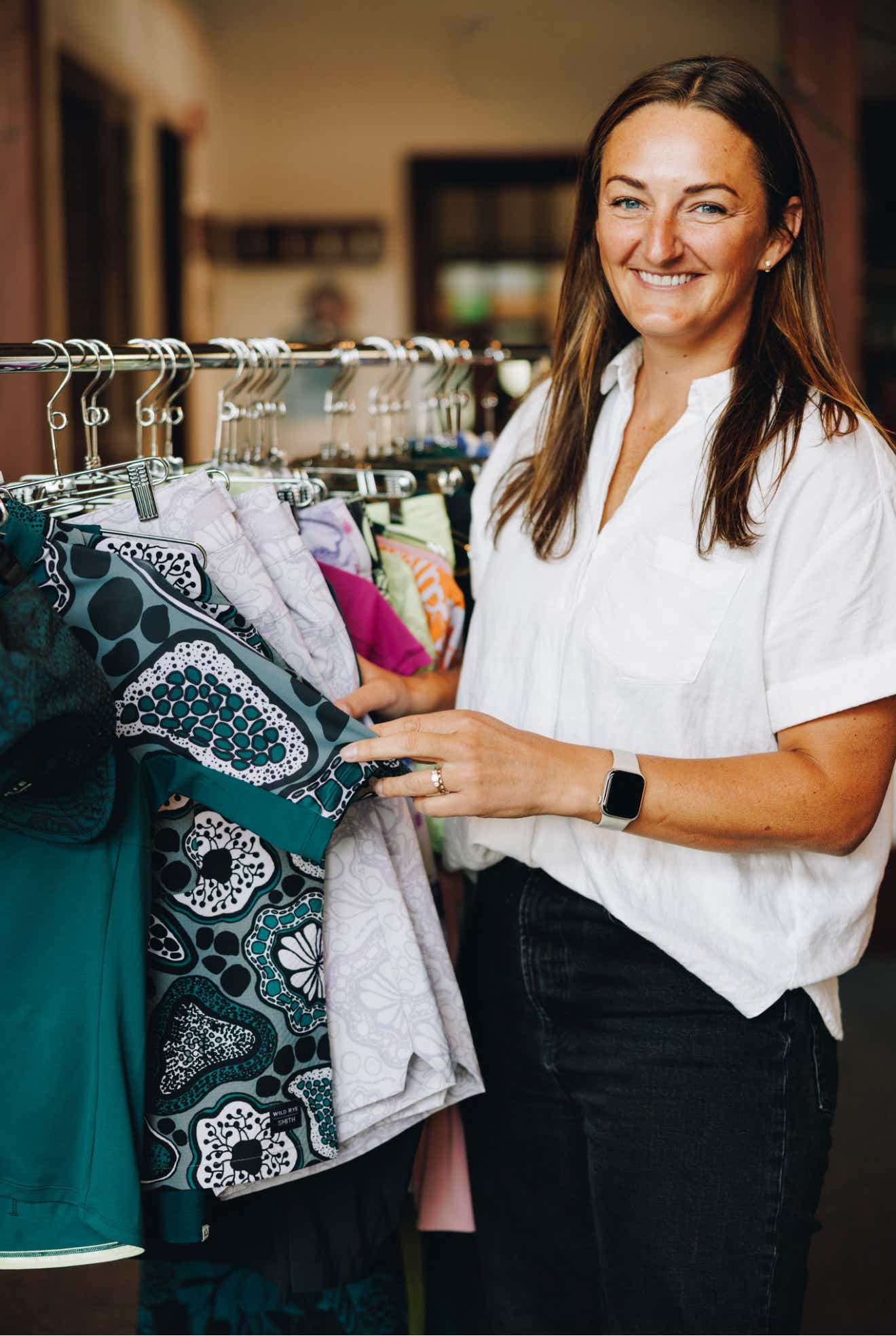 a woman holding clothes
