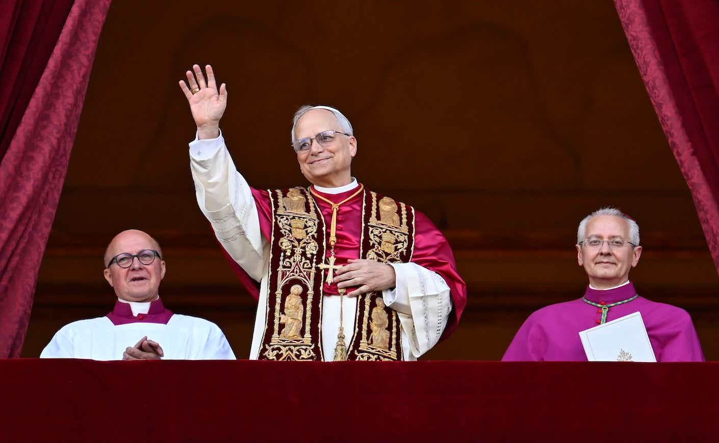 Newly elected Pope Leo XIV, Robert Prevost addresses the crowd on the main central loggia balcony overlooking St Peter's Square on May 08, 2025 in Vatican City