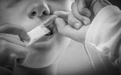 a young person putting a nicotine pouch under their lip