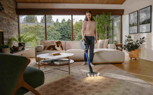 Woman vacuuming with bissell vacuum