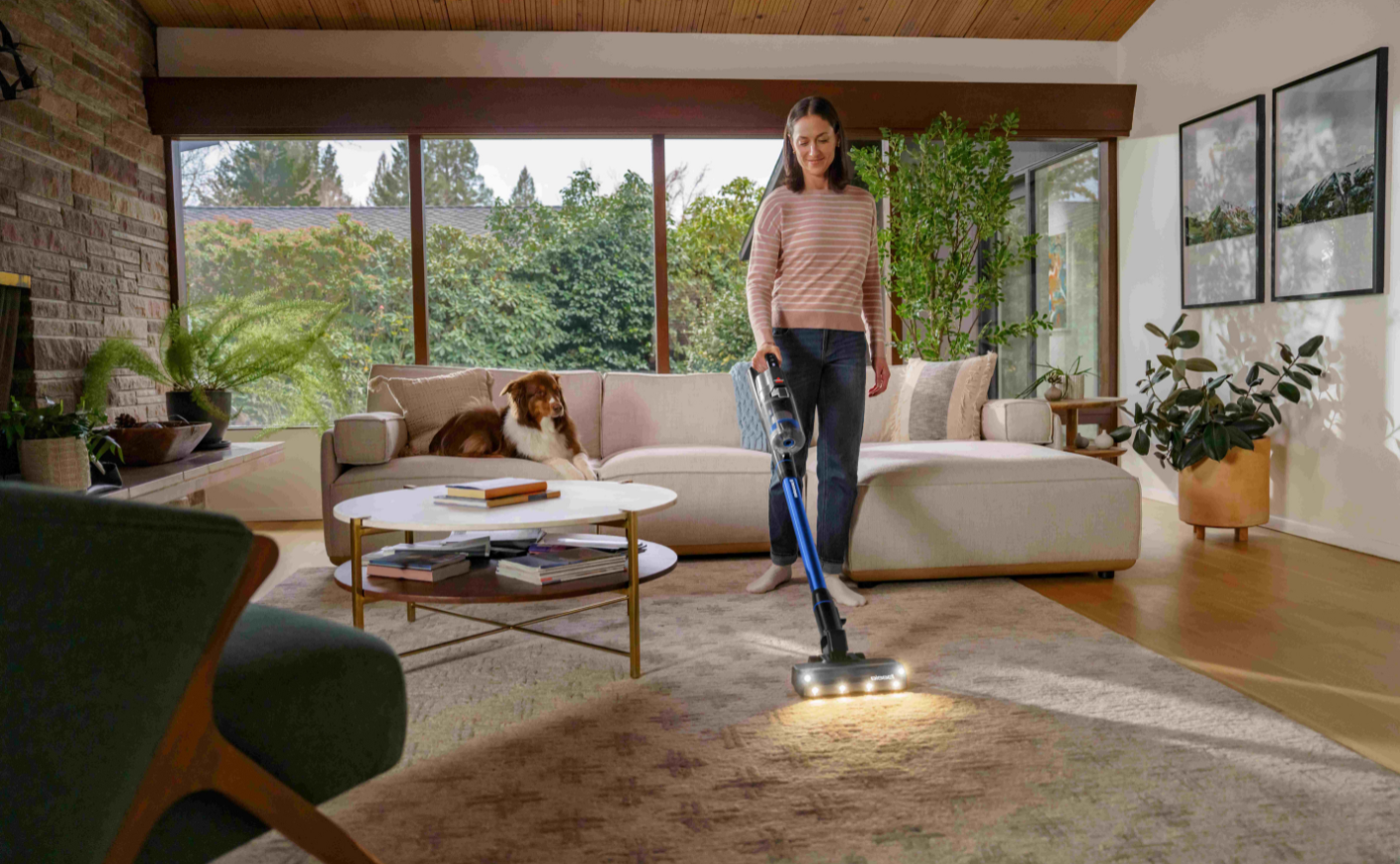 Woman vacuuming with bissell vacuum