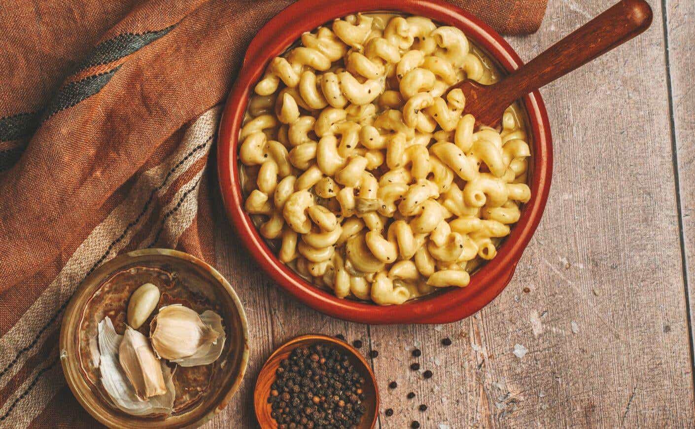 A dish of hatch chile mac and cheese surrounded by ingredients.