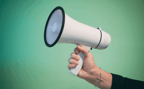 hand holding megaphone