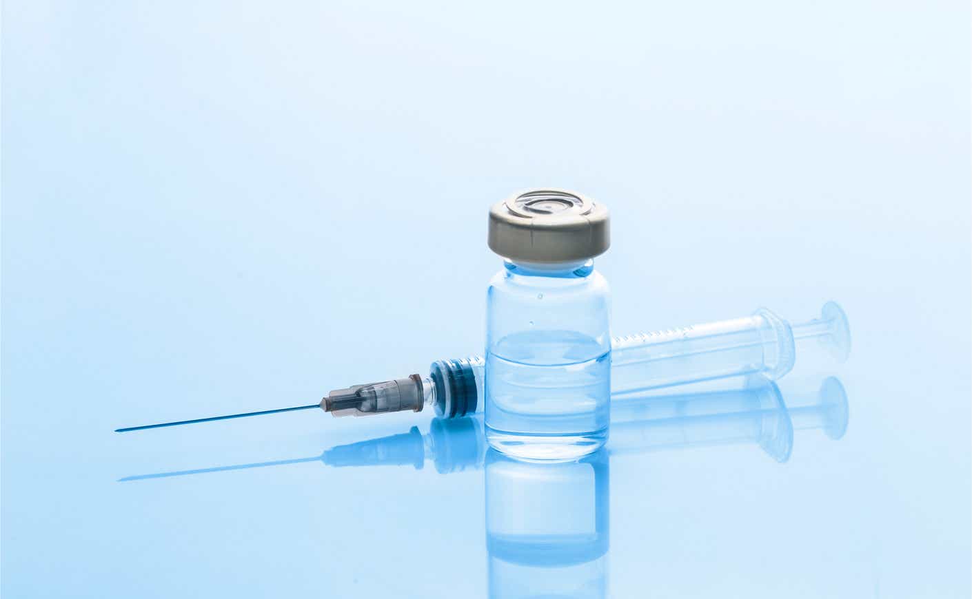 a vial with a syringe