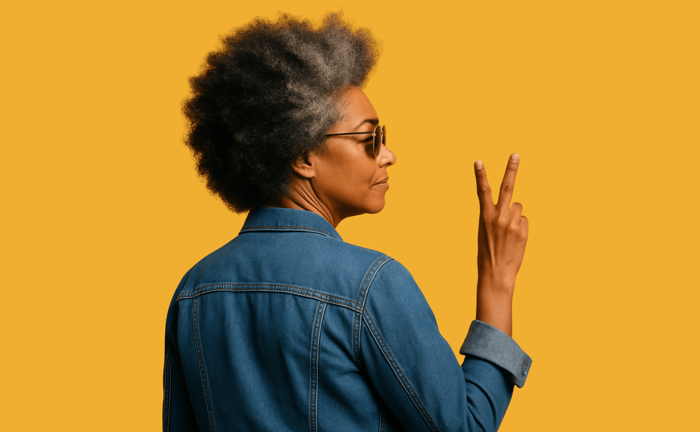 black woman giving peace sign confident