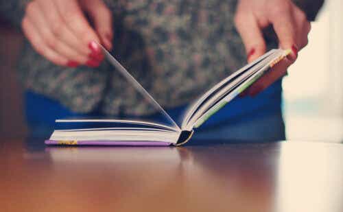 woman's hands holding a book