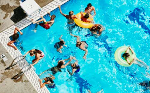 Group of friends playing together in outdoor pool