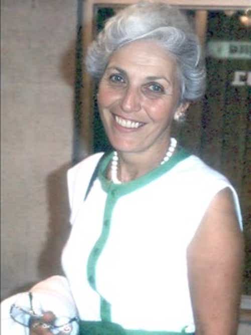 elderly woman with gray hair smiling