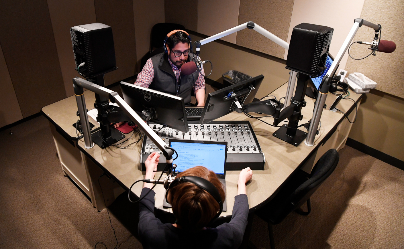 A man and a woman doing a radio show