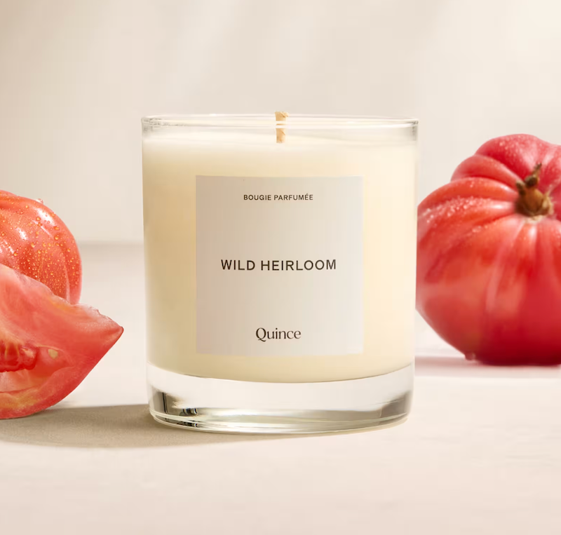 quince candle surrounded by tomatoes