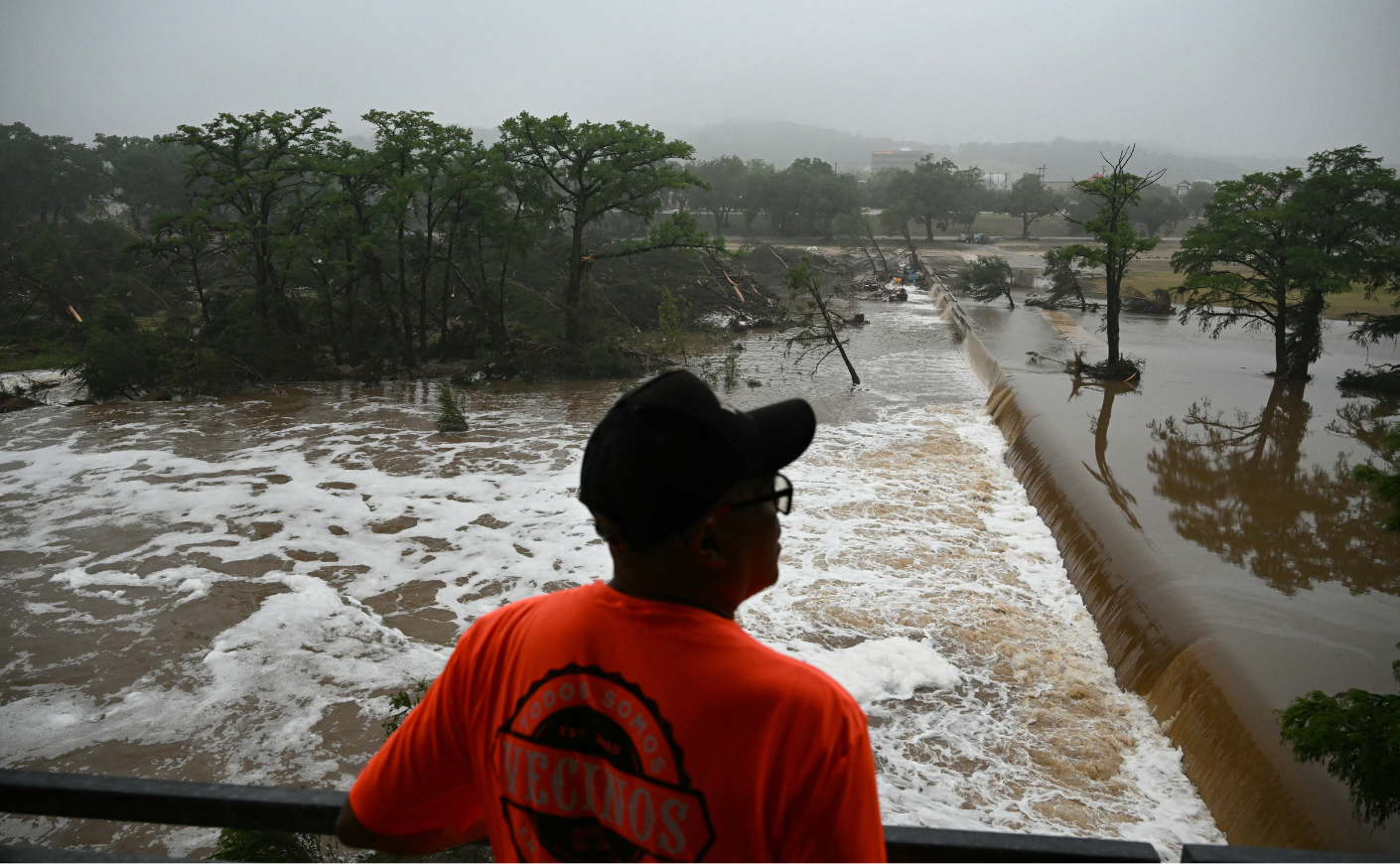 A man looks out at flooding caused by a flash flood at the Guadalupe River in Kerrville, Texas, on July 5, 2025.