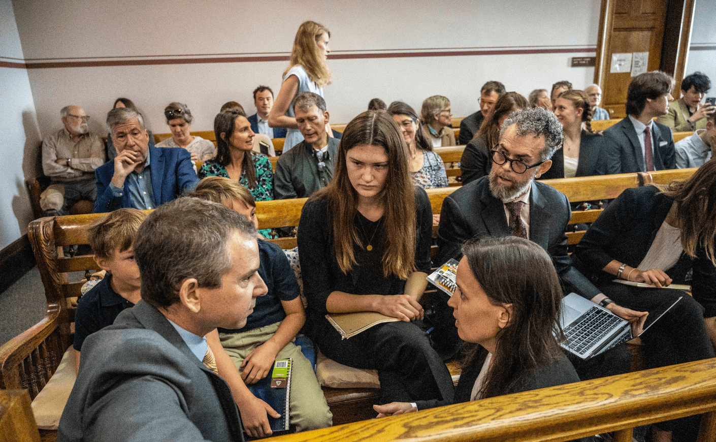 people sit in a courtroom