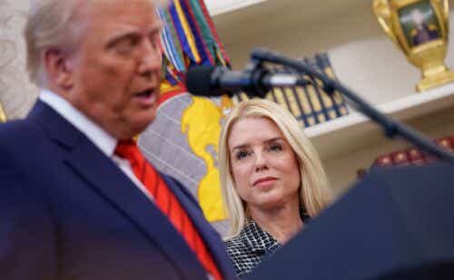 pam bondi looking at donald trump as he speaks
