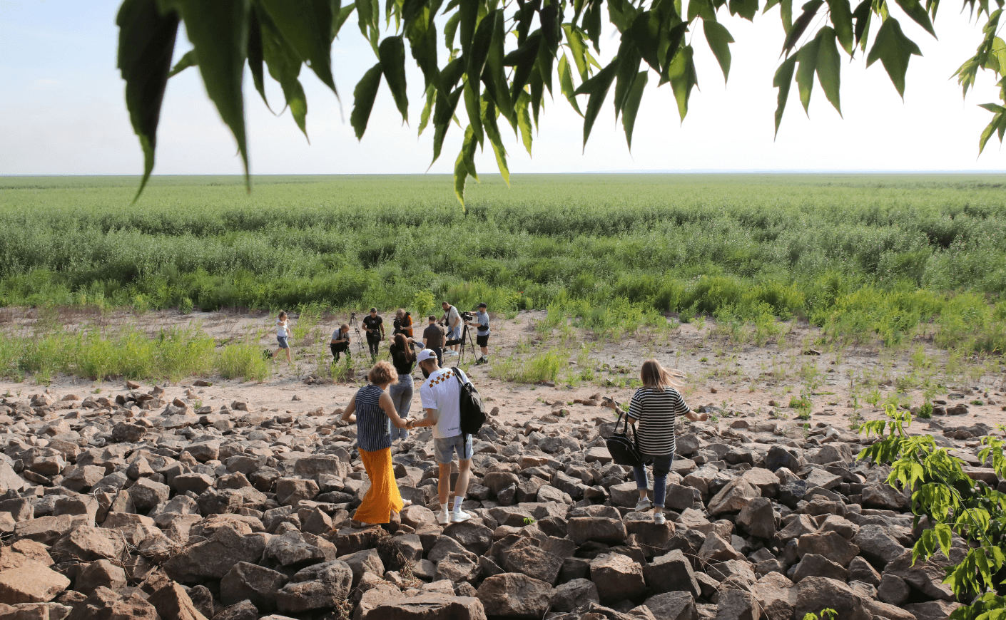 people walking across a dam