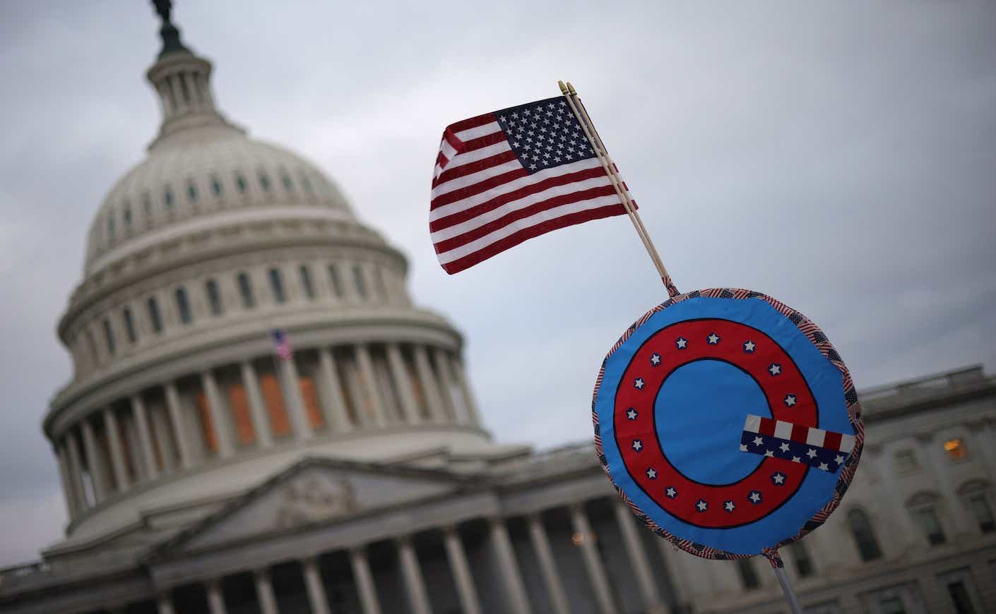 a Q sign in front of the capitol