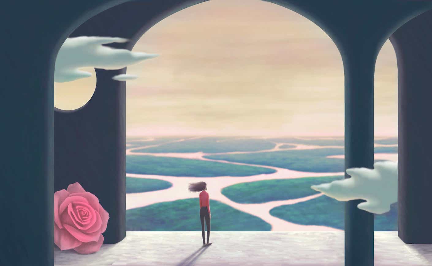 woman standing in an arch looking out at different paths/waterways