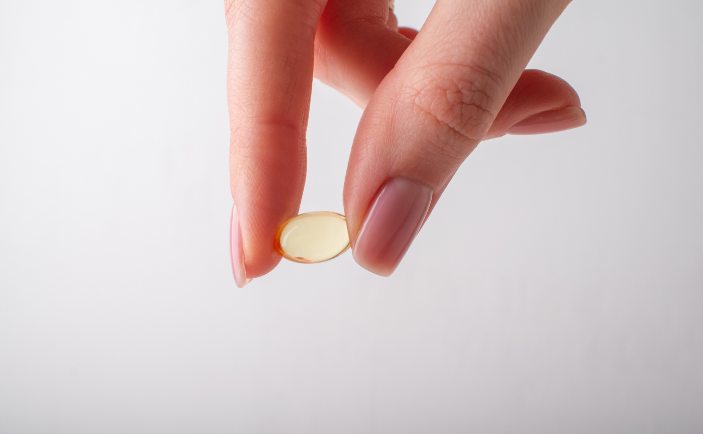 a person holds a pill