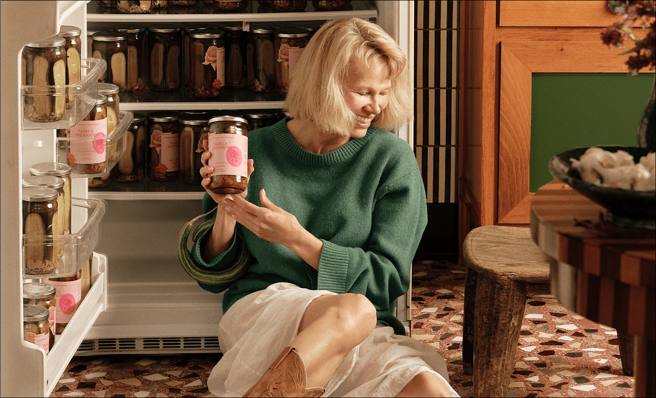 Pamela Anderson holding her pickles