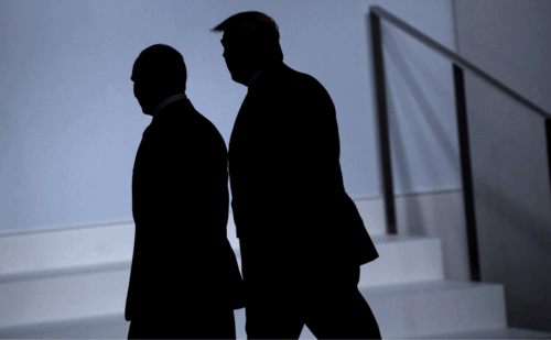 The shadowed silhouettes of Vladimir Putin and Donald Trump