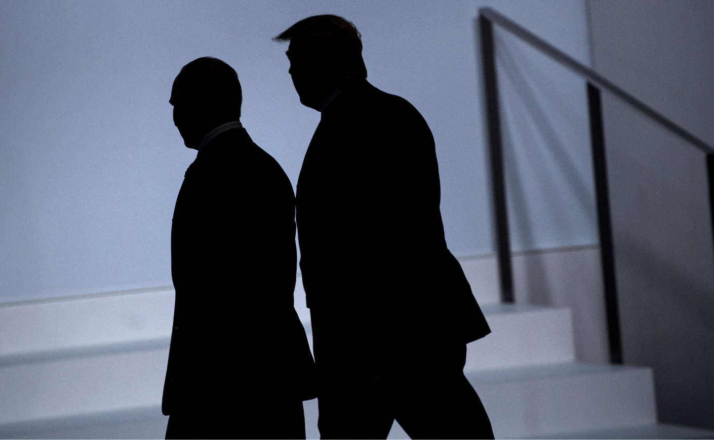 The shadowed silhouettes of Vladimir Putin and Donald Trump