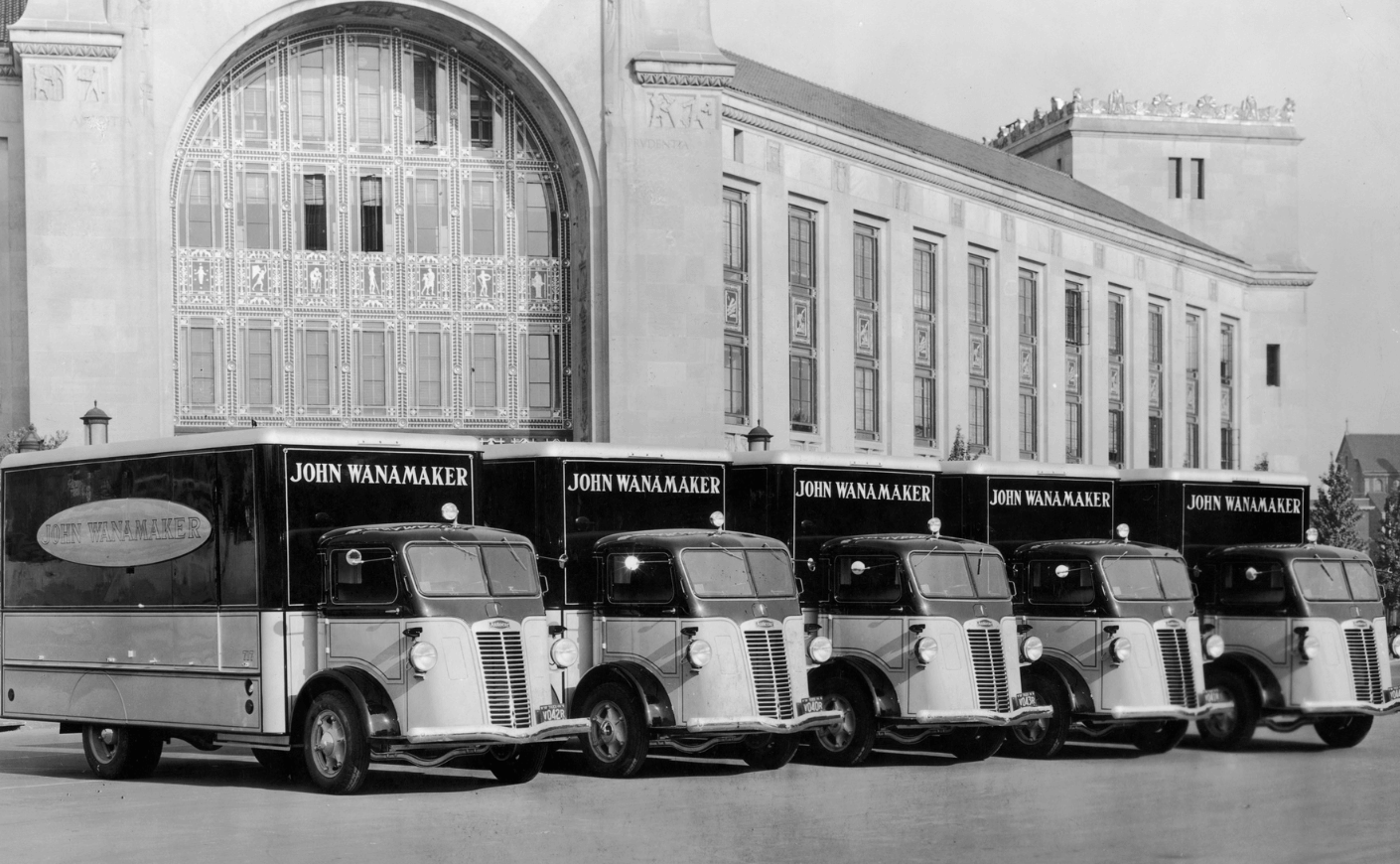 black-and-white photo of trucks outside Wanamaker's department store in Philadelphia