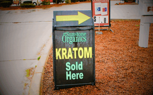 a sign outside that says "kratom sold here"