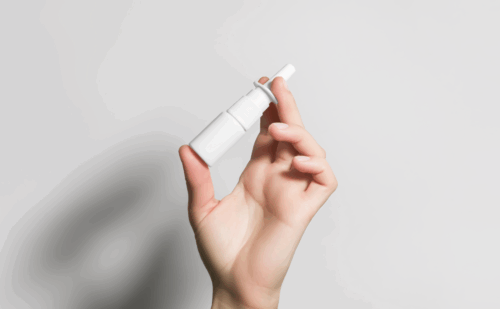 hand holding nasal spray