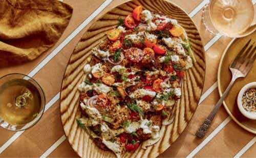 A panzanella salad on a wooden platter.