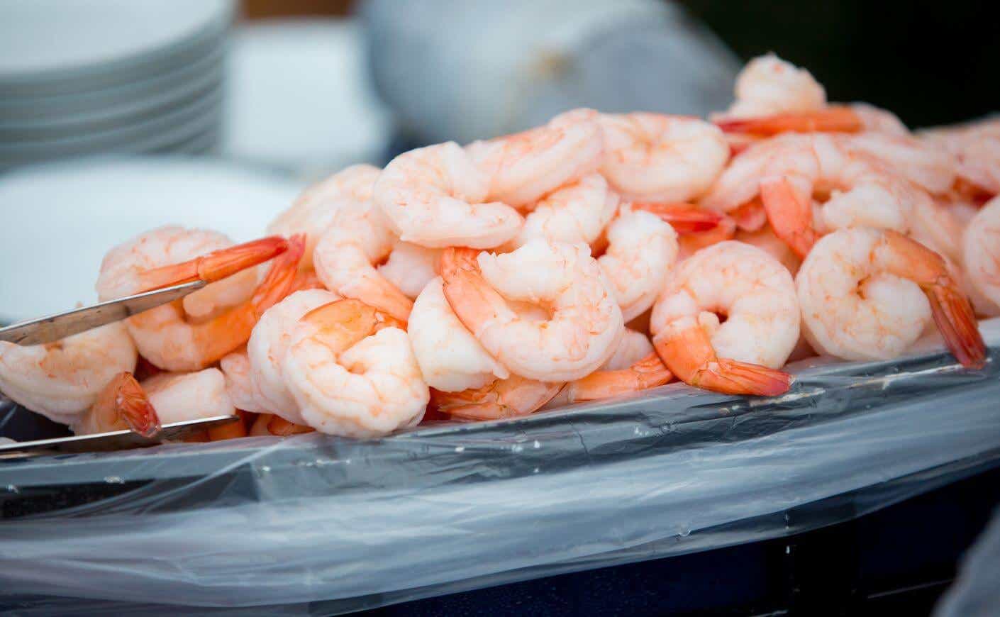 A tray of cooked shrimp.