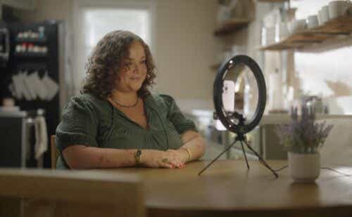 Casey records a video in front of a ring light