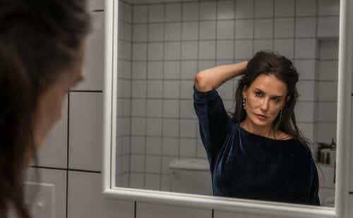 demi moore looking in a mirror in the movie Substance