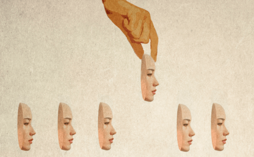 woman picking out a mask