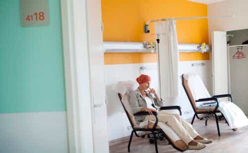 Woman in hospital room receiving chemotherapy