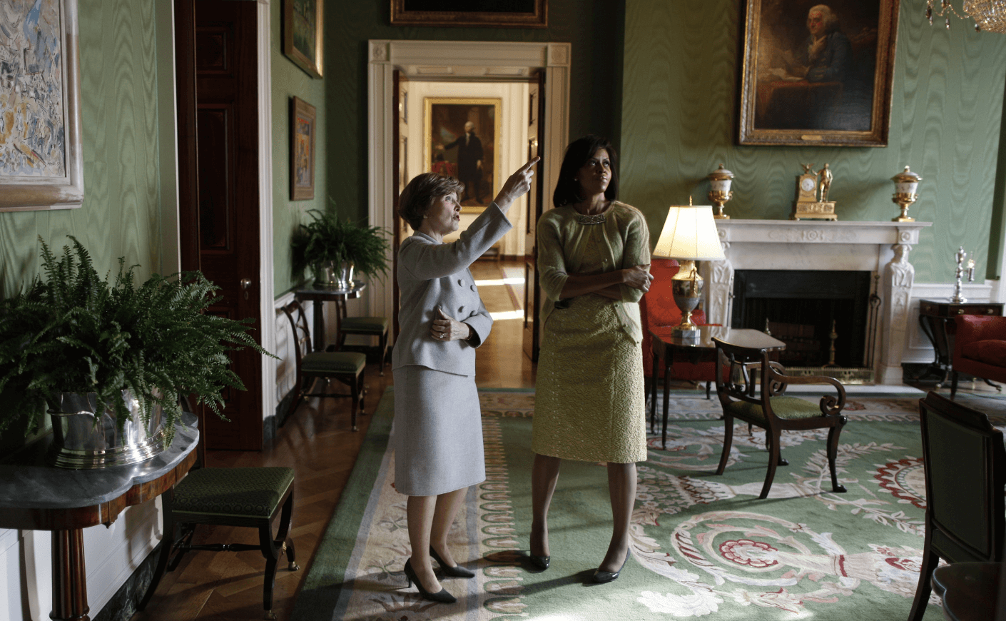 Laura Bush gives Michelle Obama a private tour of the Green Room ahead of Barack Obama’s inauguration on January 20, 2009