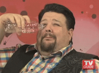 Gif of Project Runway's Chris March fake crying while pouring water in his eyes