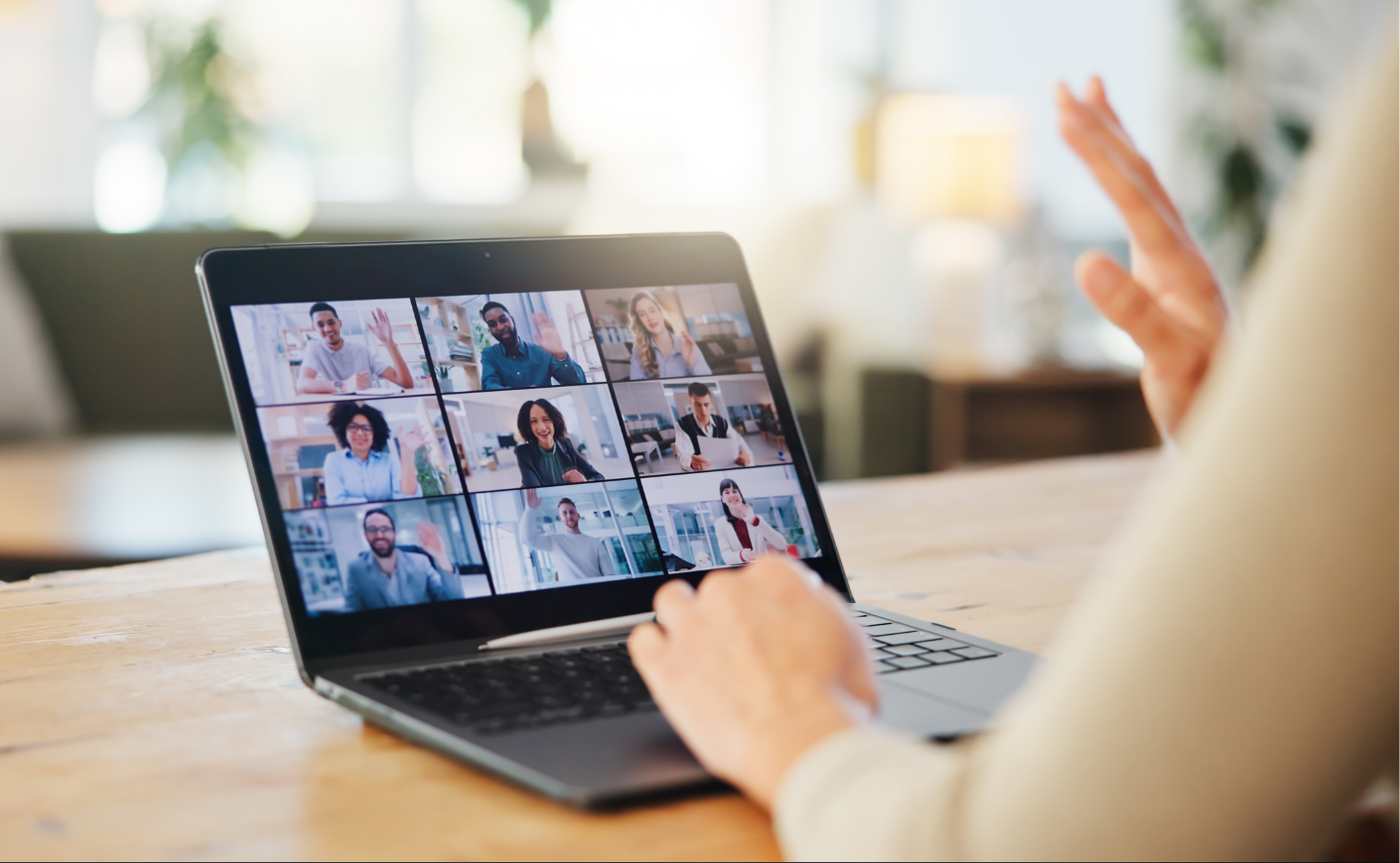 A woman taking a remote meeting on her laptop