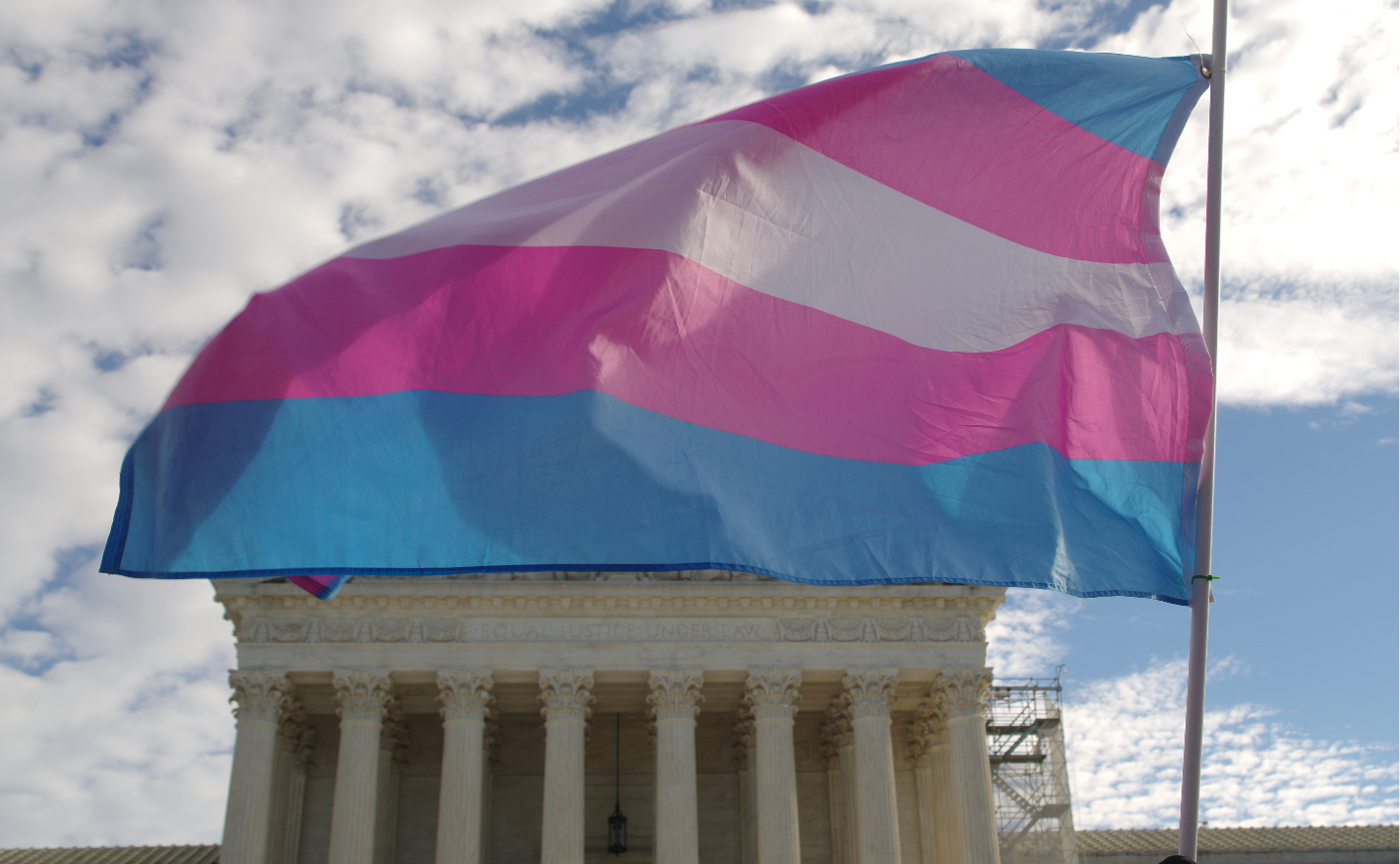 A trans flag flying in front of the Supreme Court