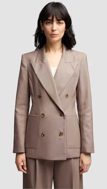 A model wearing an Argent blazer.