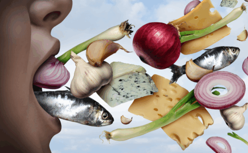 An open mouth with all sorts of stinky foods coming out of it