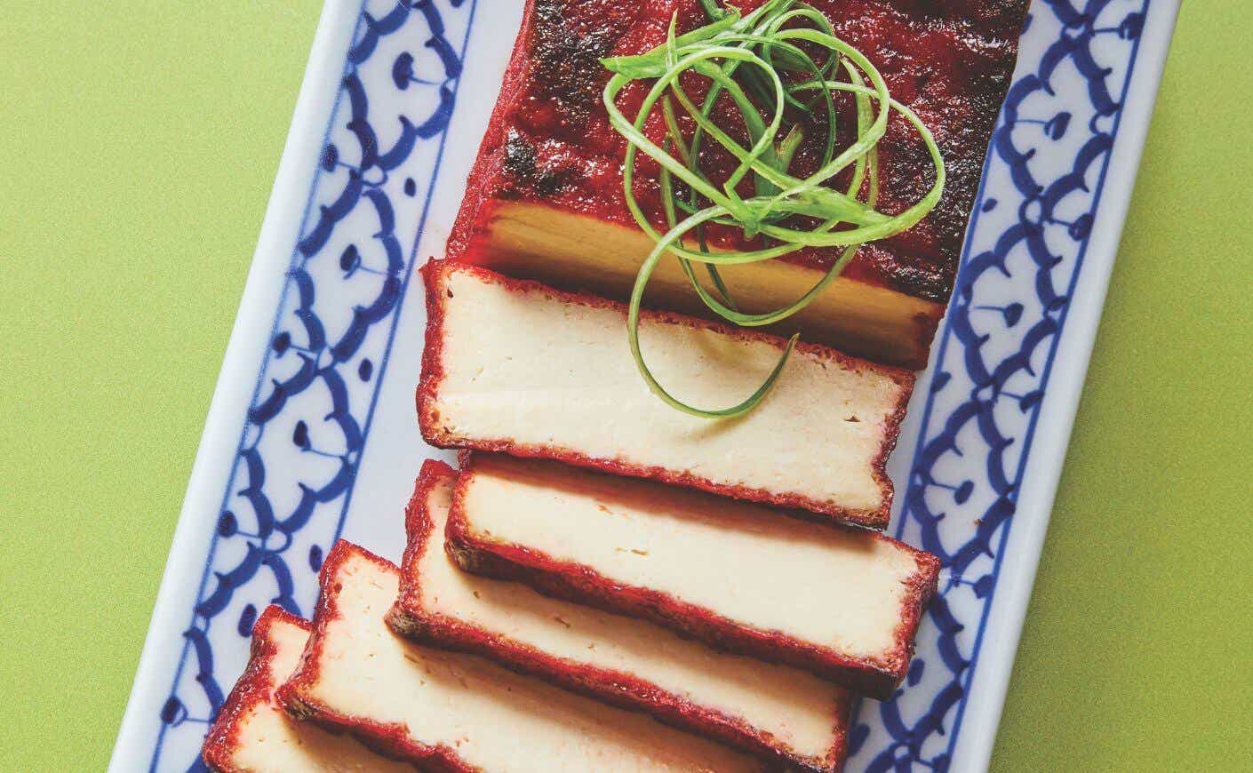 Sliced char siu tofu on a tray.