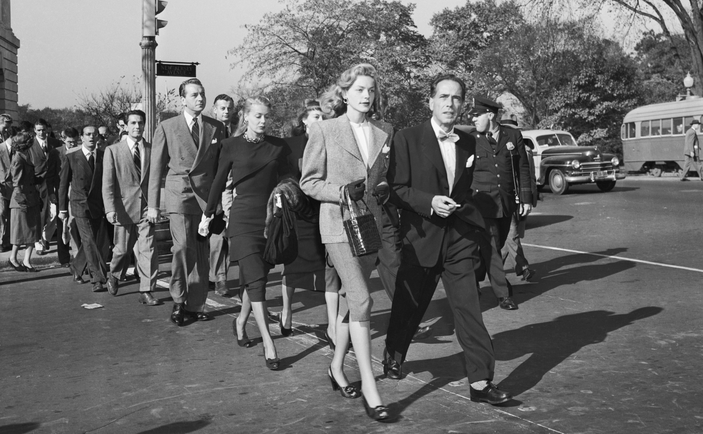 Movie stars, led by Lauren Bacall and Humphrey Bogart, protest hearings by the House Committee on Un-American Activities in 1947.