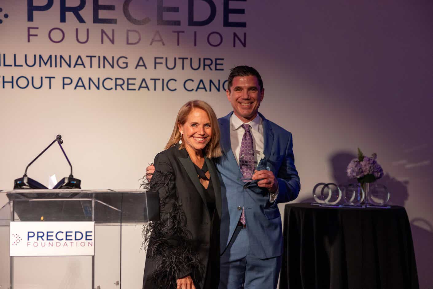 katie and her nephew ray wadlow accepting an award