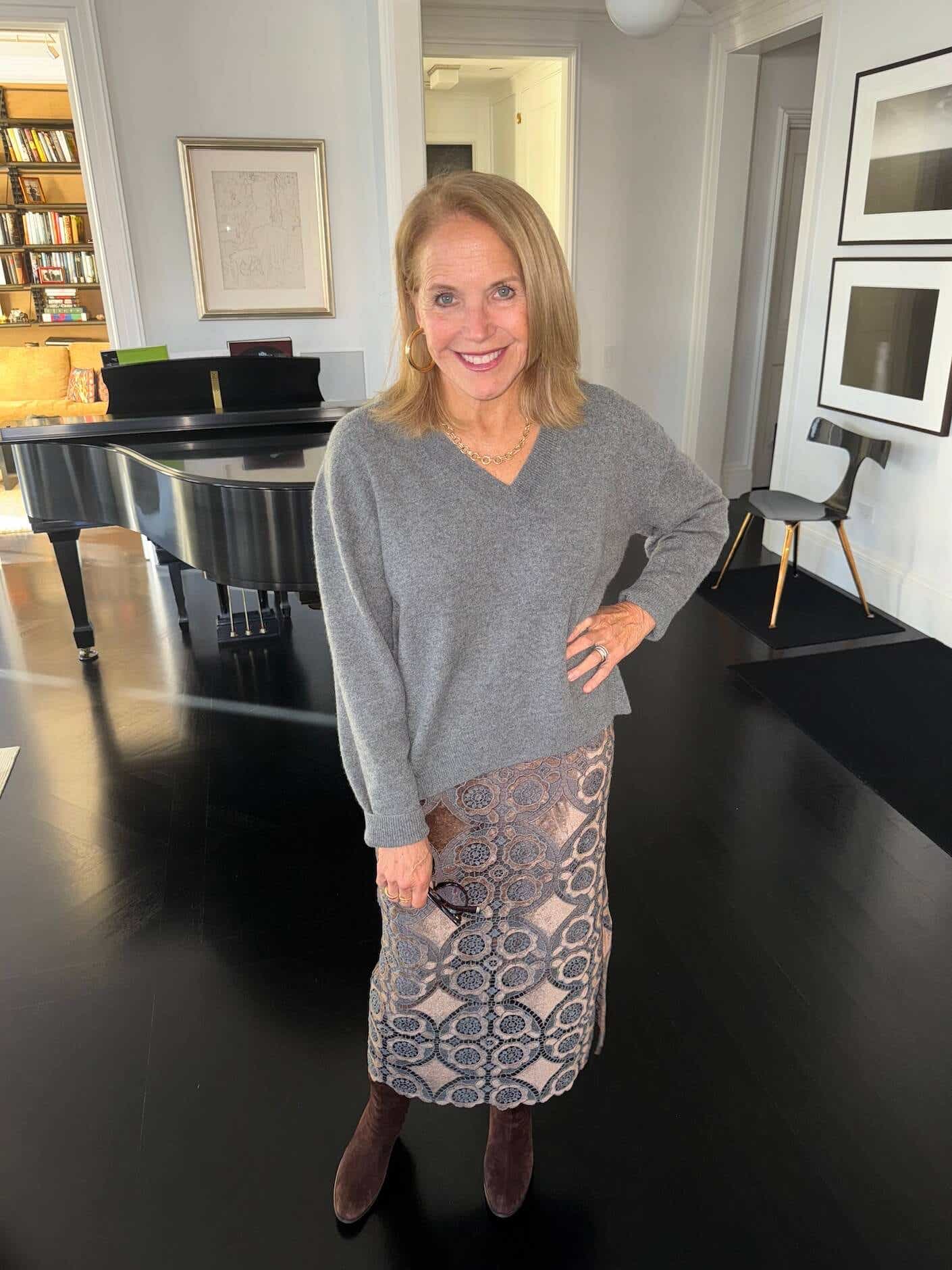 Katie Couric wears a cozy sweater and maxi skirt.
